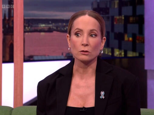 Joanne Froggatt wearing a Long COVID awareness ribbon pin on an interview with The One Show.